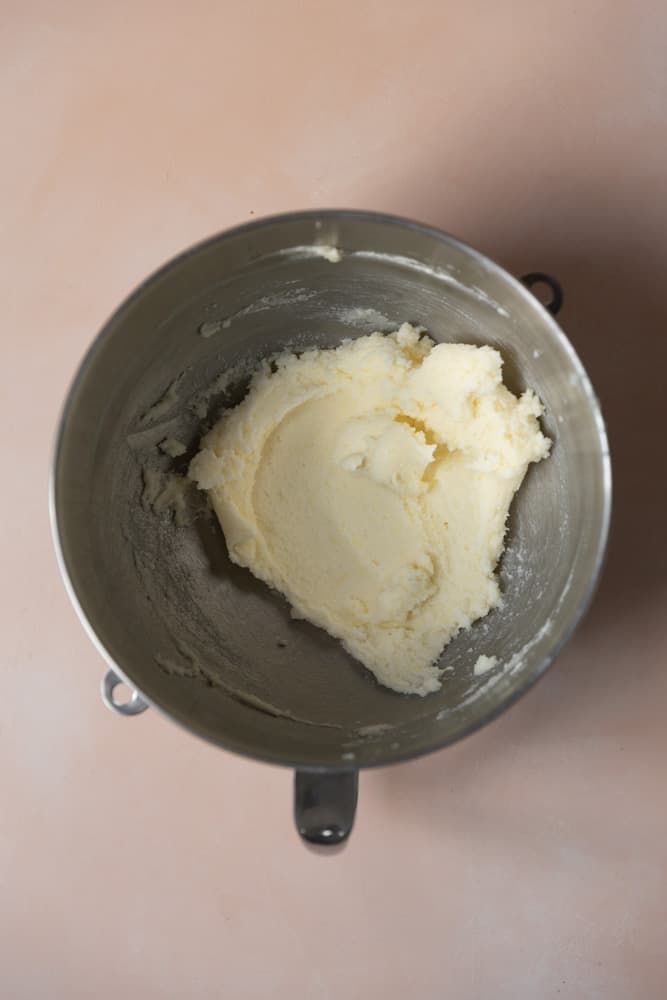 Butter and sugar creamed in a mixing bowl.