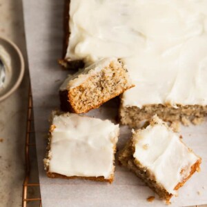 Three pieces of banana cake cut off the corner of the sheet cake.