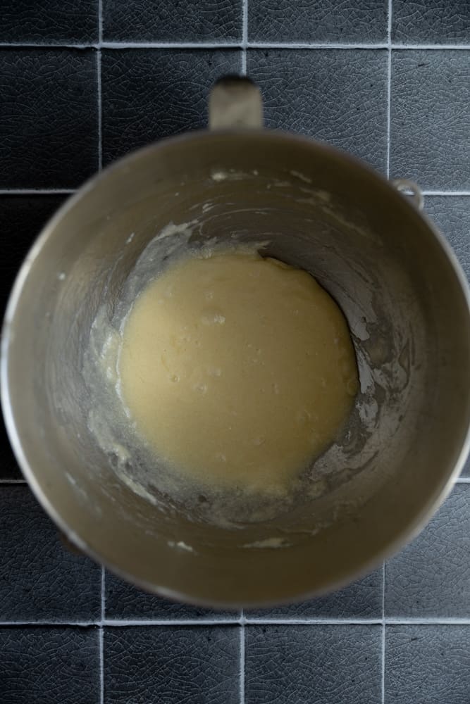 Creamed butter, sugar, and eggs in a mixing bowl.