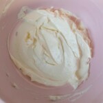 Cream cheese and butter creamed in a pink bowl