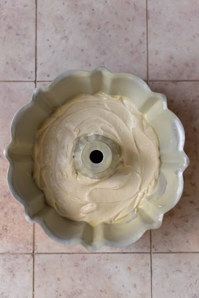 A layer of vanilla batter in a bundt pan.