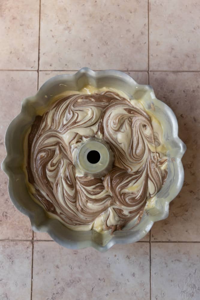 Marbled vanilla and chocolate cake flavors swirled in a bundt pan.
