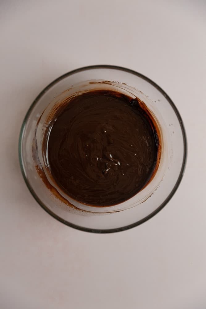 Melted chocolate and butter in a glass bowl.