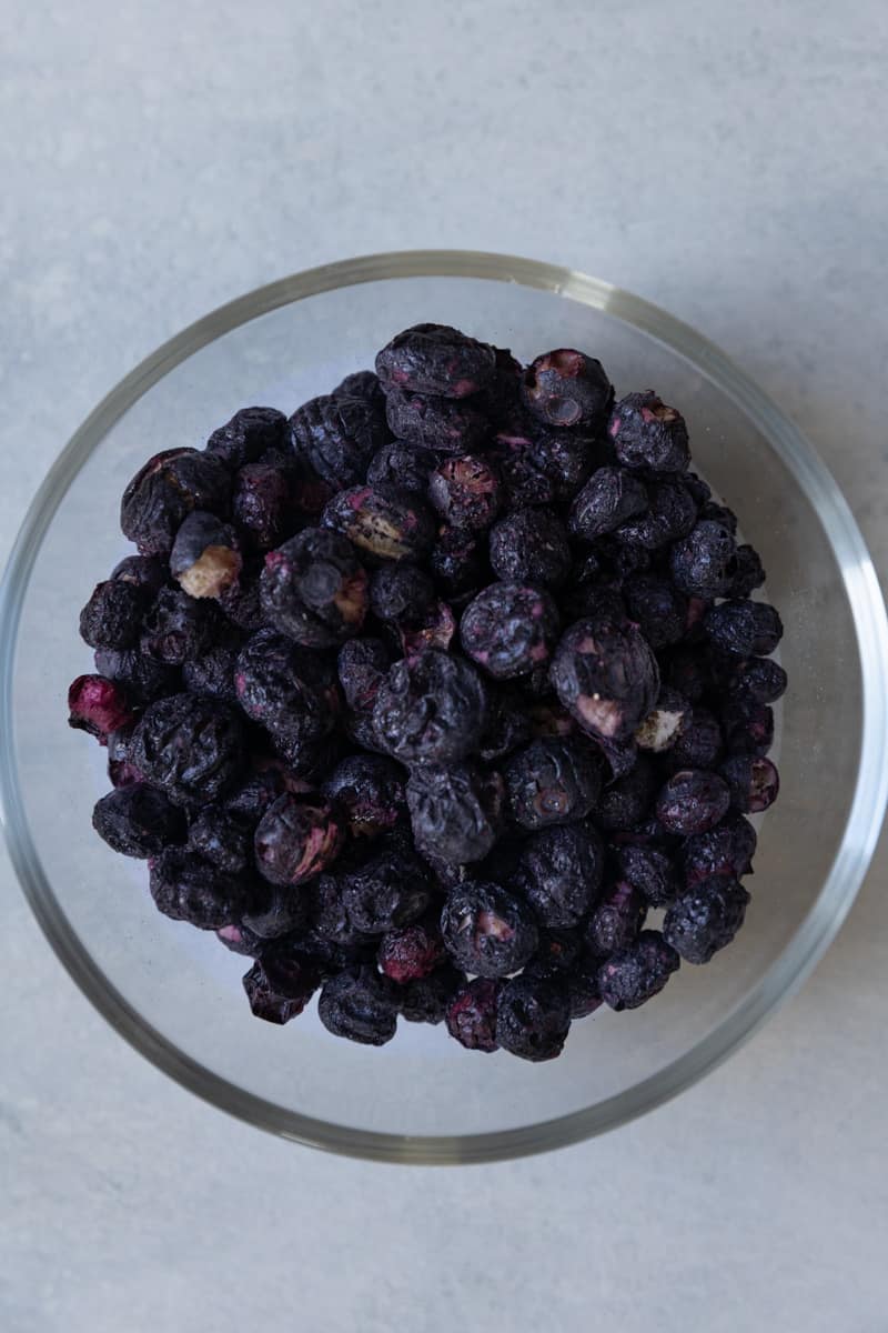 Freeze dried blueberries in a glass bowl.