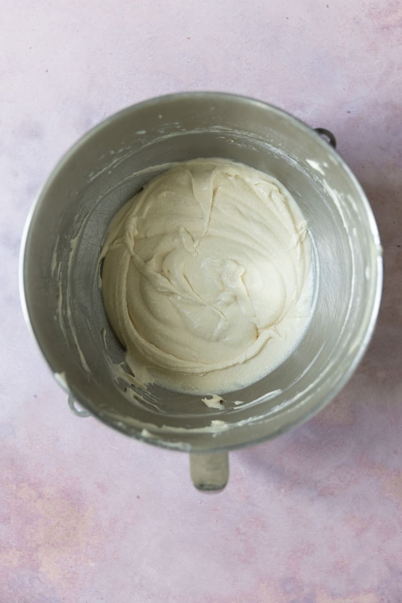 Vanilla cake batter in a mixing bowl.