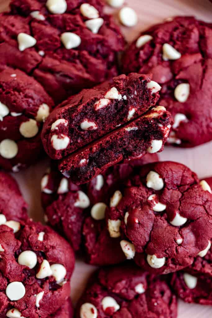 A red velvet cookie split in half to show the inside.