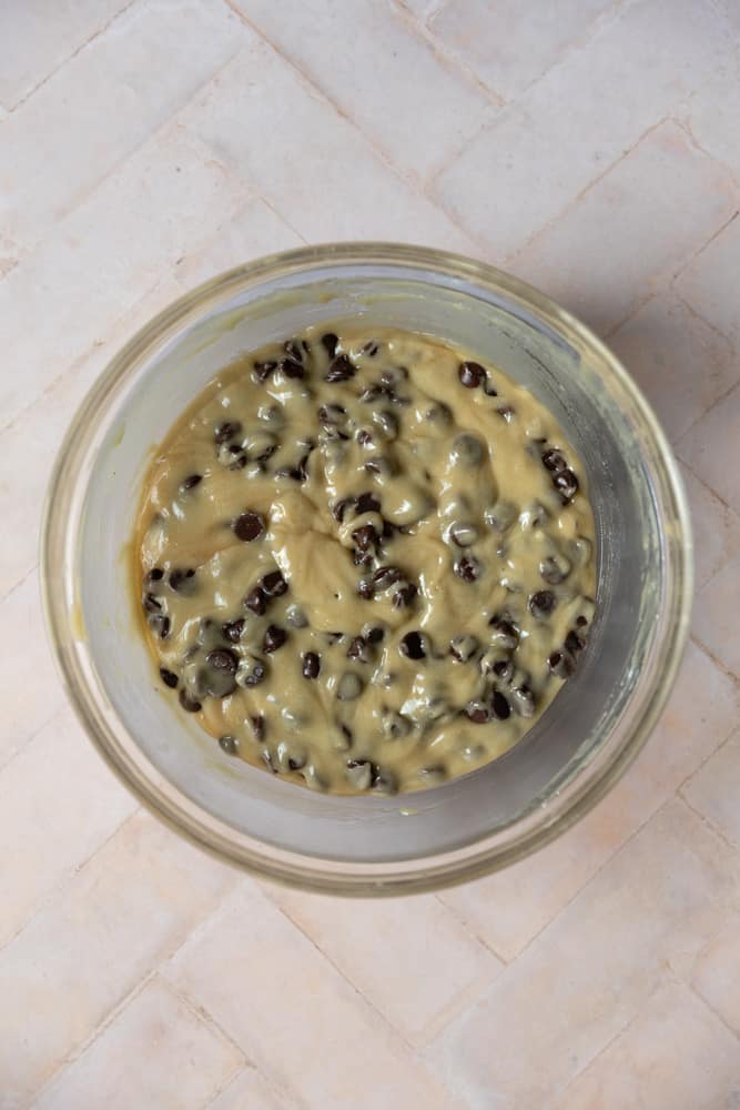 Chocolate chip cookie dough made without brown sugar in a glass bowl.