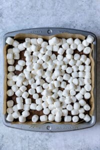 Mini Marshmallows on top of baked brownies.