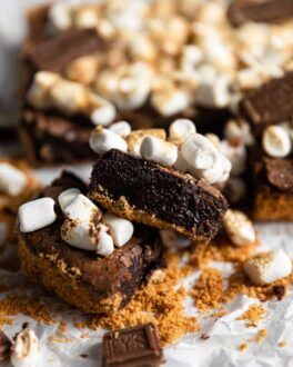 A s'mores brownie on an angle to show off the fudgy chocolate insides.