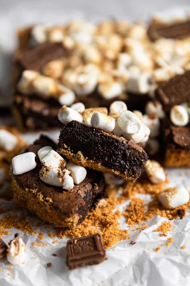 A s'mores brownie on an angle to show off the fudgy chocolate insides.