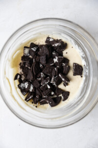 Crushed Oreos added to cheesecake batter.