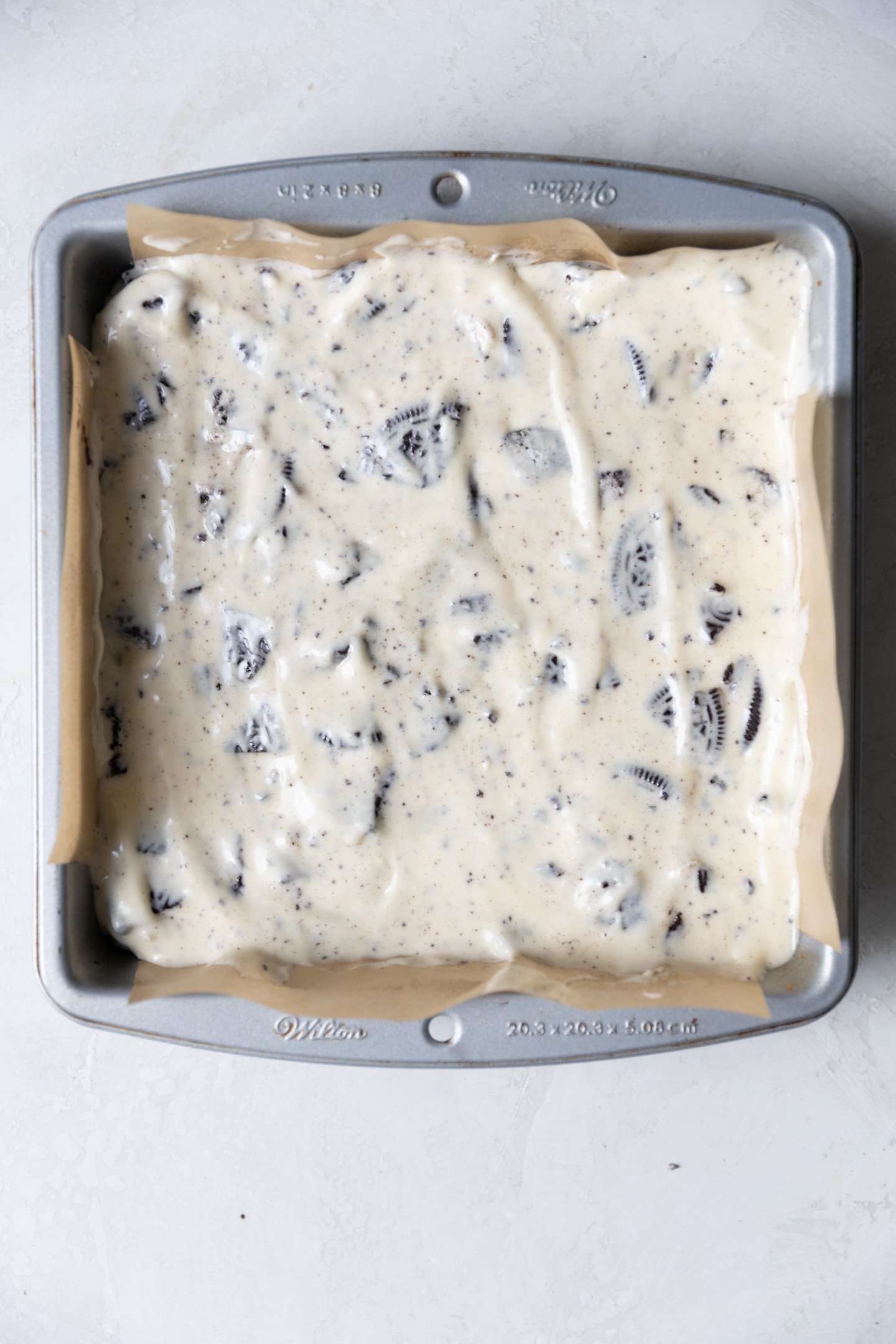 Oreo cheesecake brownie batter in a 8x8 pan.