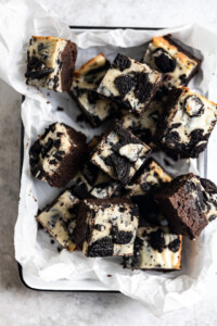 A tray of Oreo Cheesecake brownies in a tin.