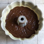 Brownie cake batter in a greased bundt pan.