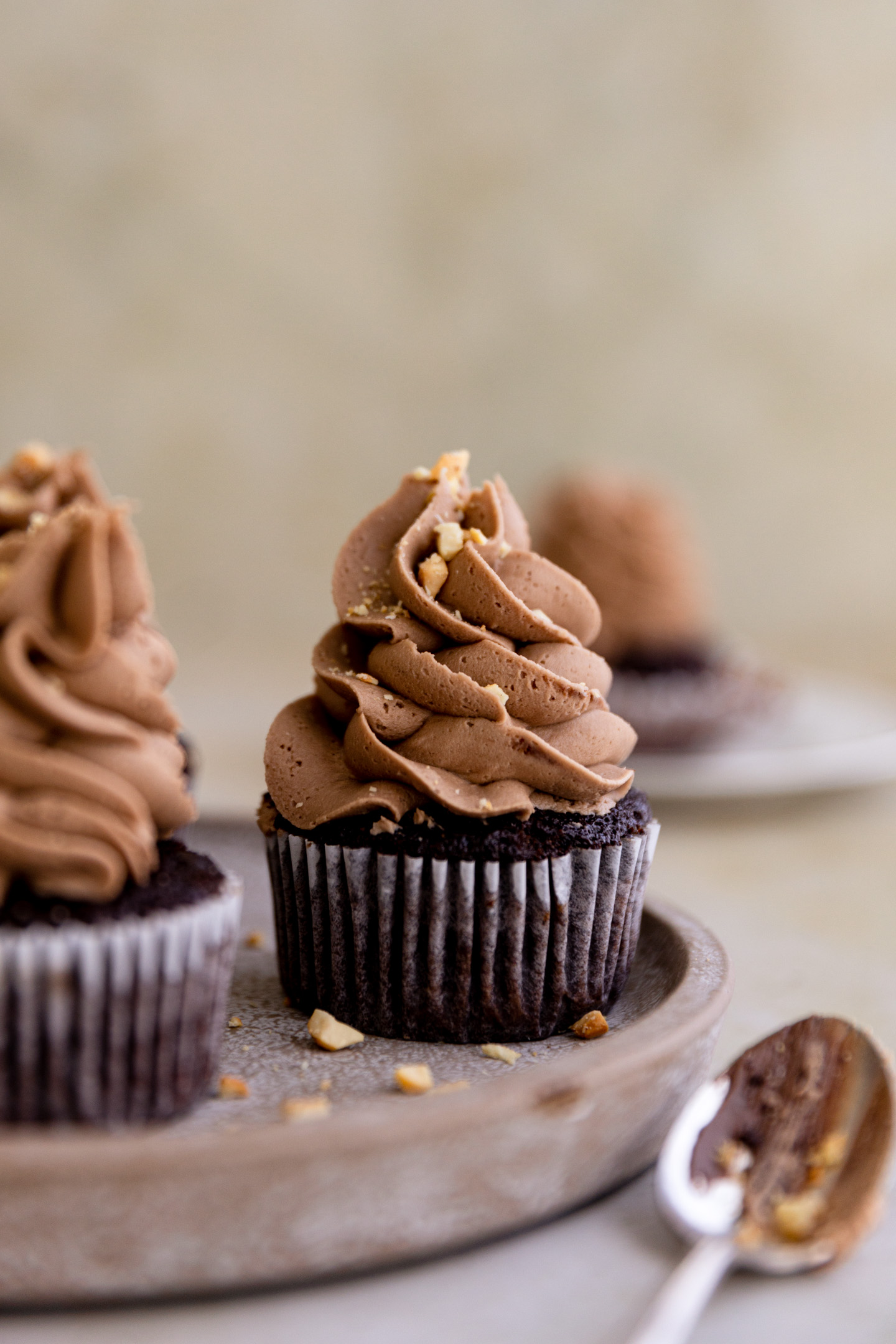 A Nutella cupcake on a brown plate.