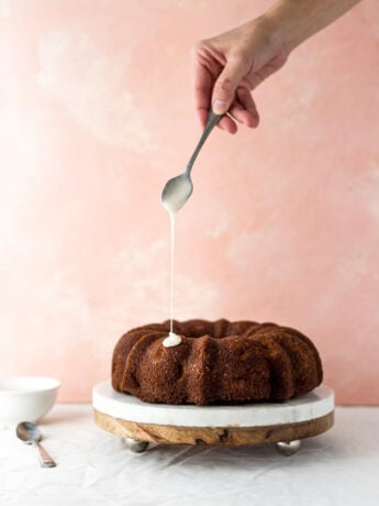 A bundt cake drizzled with honey glaze.