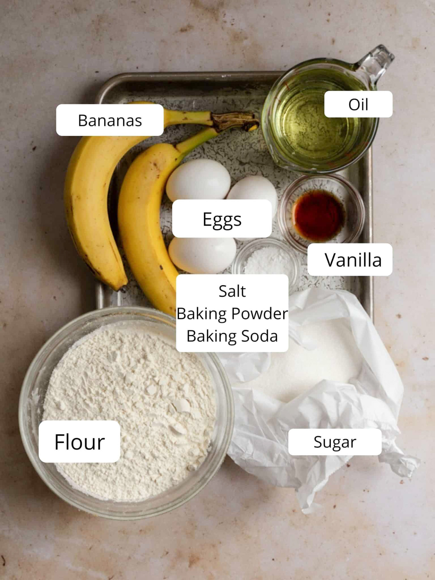 Ingredients for a banana bread with oil.