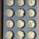 Cupcake batter in a 12 cup muffin tin.