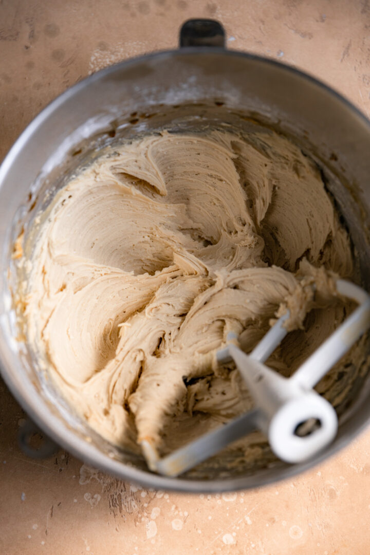 Cookie dough frosting without chocolate chips whipped in a mixing bowl.