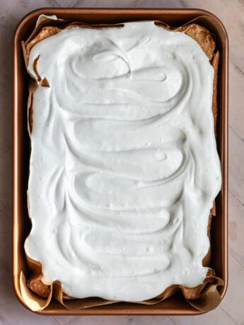 7 minute frosting spread over a vanilla sheet cake.