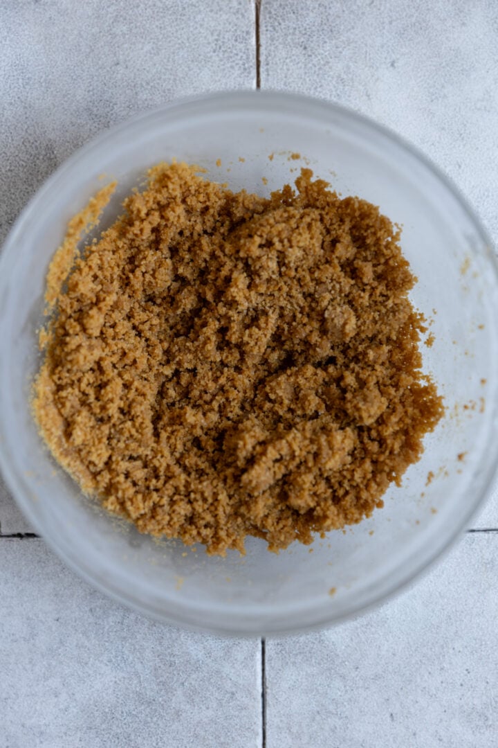 Graham cracker streusel in a glass bowl. 