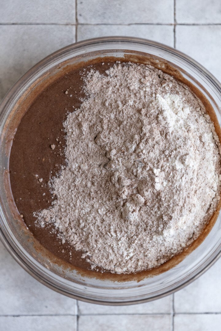Dry and wet ingredients for S'mores muffins in a bowl. 