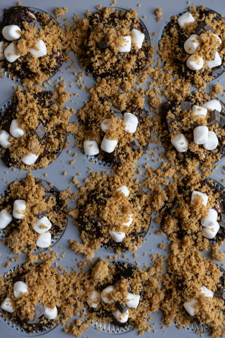 S'mores muffin batter in a muffin tin.