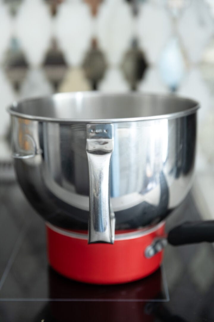 A double boiler on a stove top. 