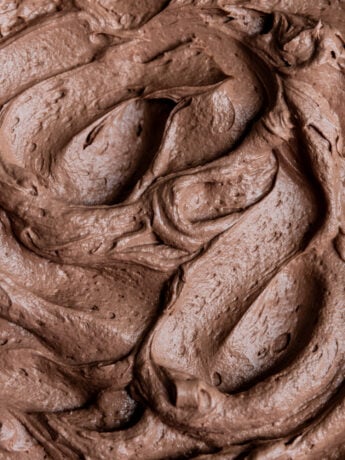 Chocolate Swiss meringue buttercream swirled in a bowl.