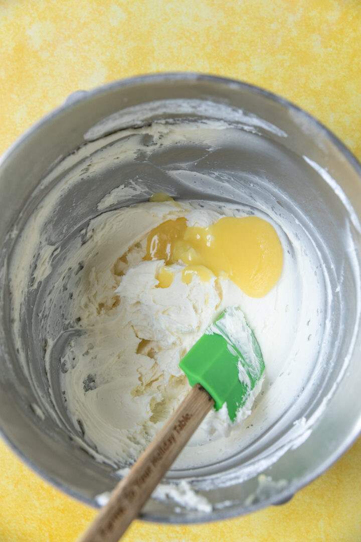Lemon curd added to frosting ingredients.
