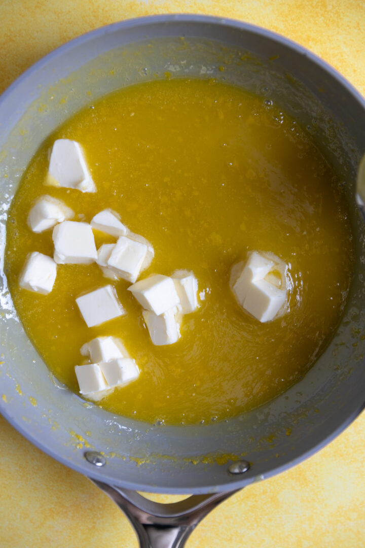 Diced butter added to lemon curd. 