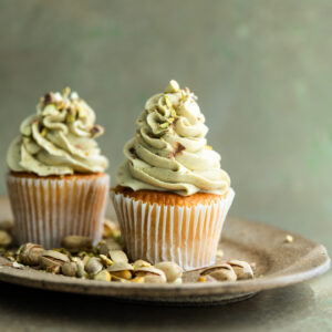 Cupcakes topped with pistachio frosting.