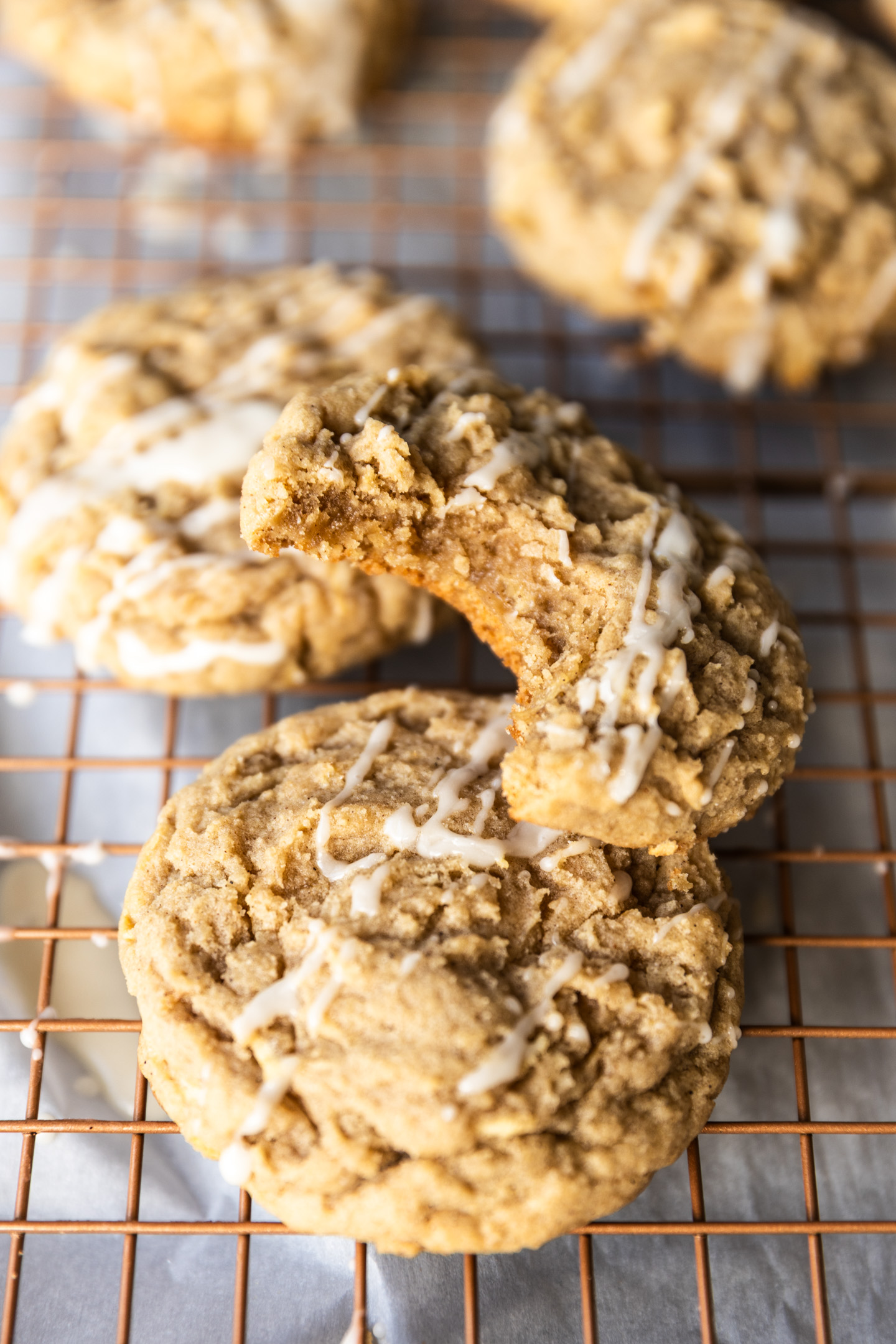 An apple cookie with a bite taken out of it.