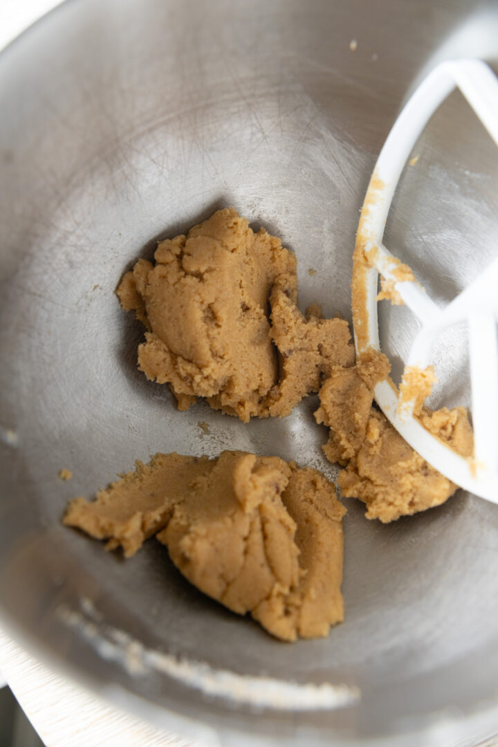 Sugar and butter creamed in a mixing bowl.