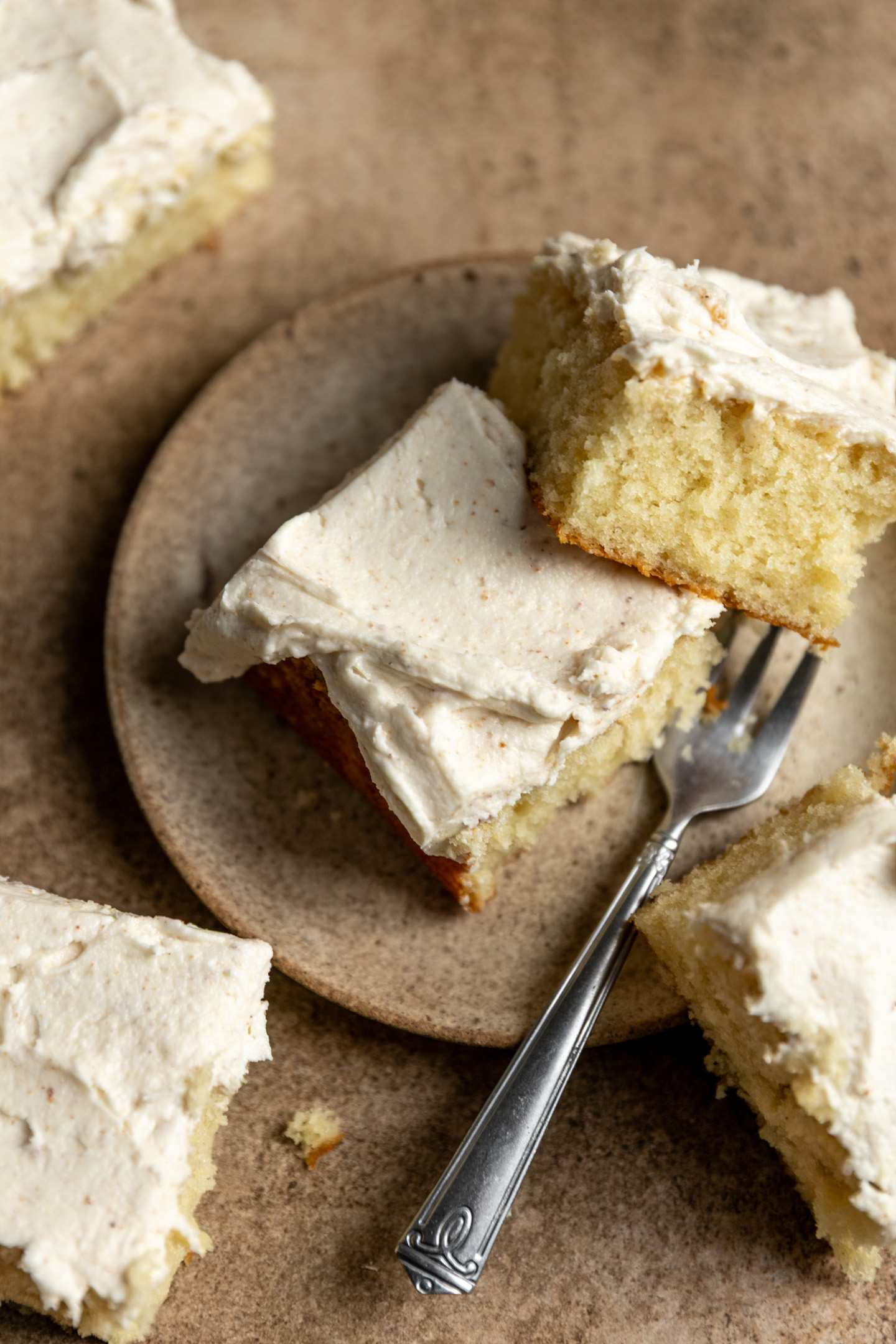 Butter cake pieces with browned butter frosting on top.