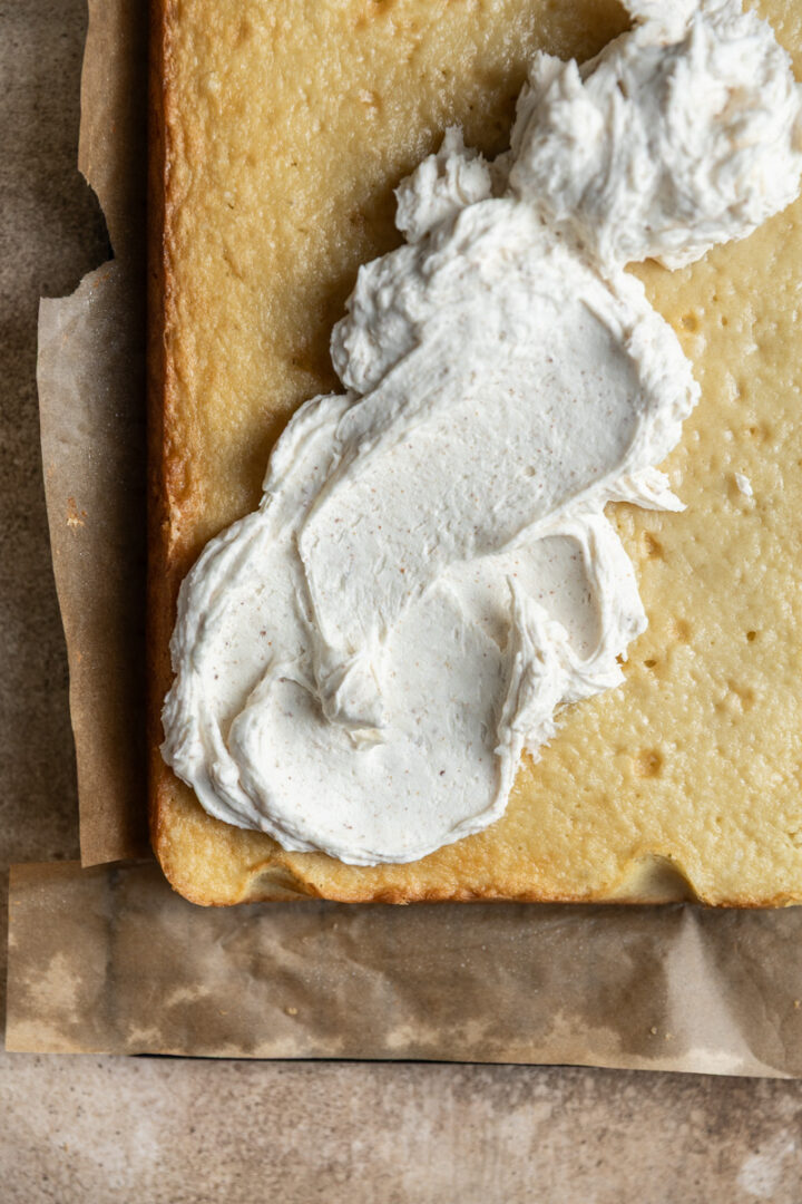 Brown butter frosting on part of a 9x13 cake.