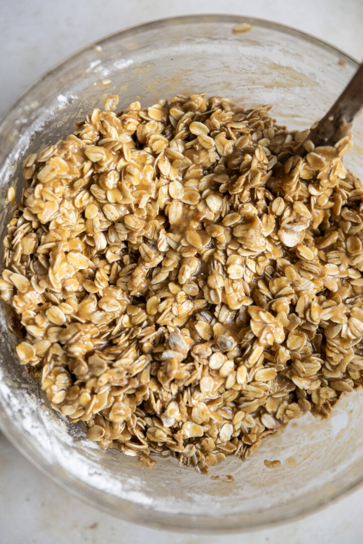 Brown sugar oatmeal cookie batter in a glass bowl.
