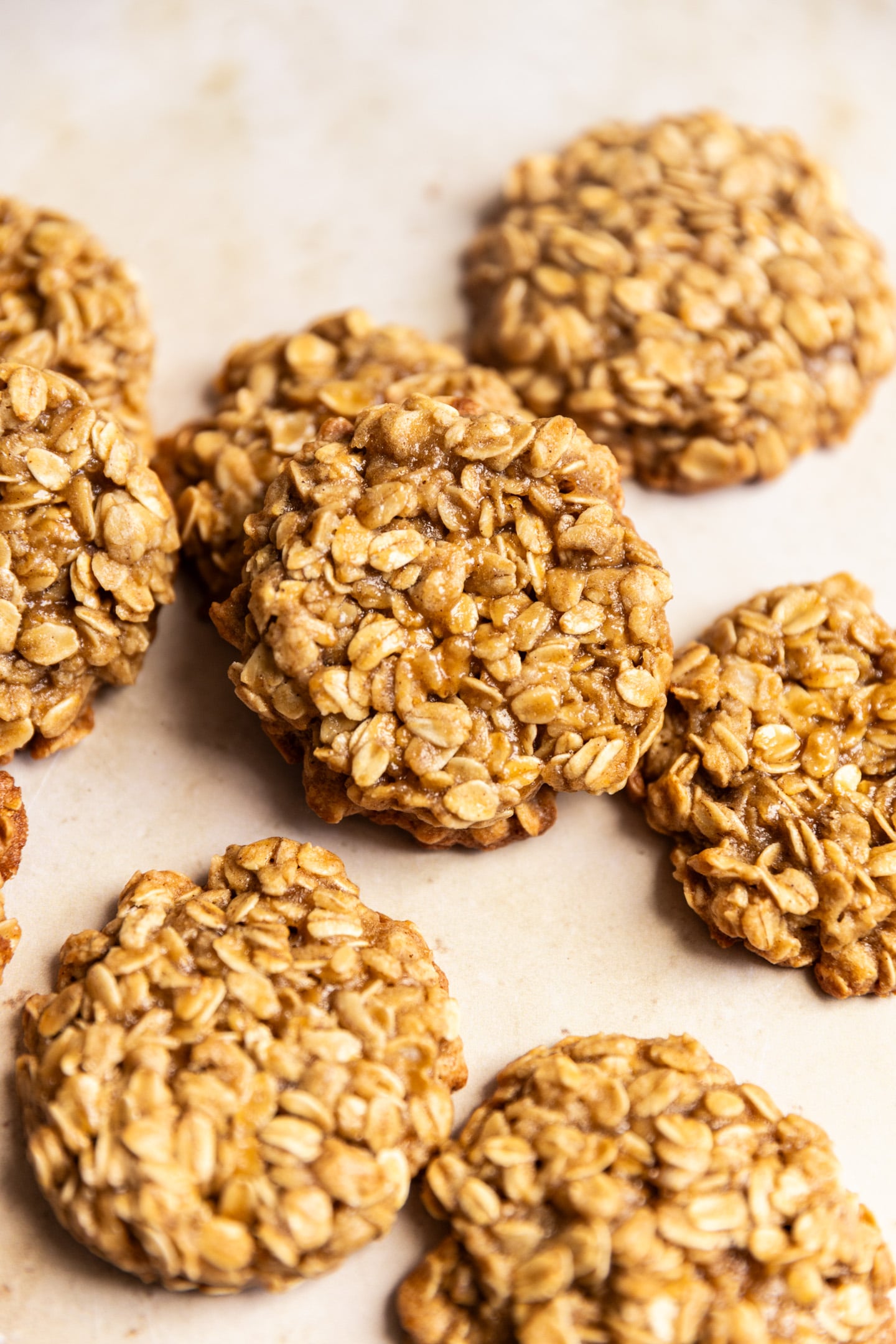 Thick and chewy brown sugar oatmeal cookies on a light surface.