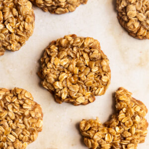 Brown sugar oatmeal cookies next to each other with one with a bite taken out.