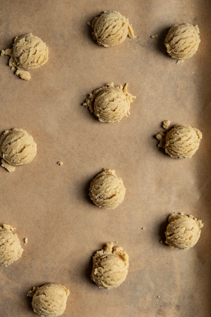 Cookie dough on a baking tray.