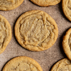 Brown sugar cookies on a brown surface.