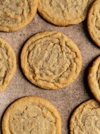 Brown sugar cookies on a brown surface.