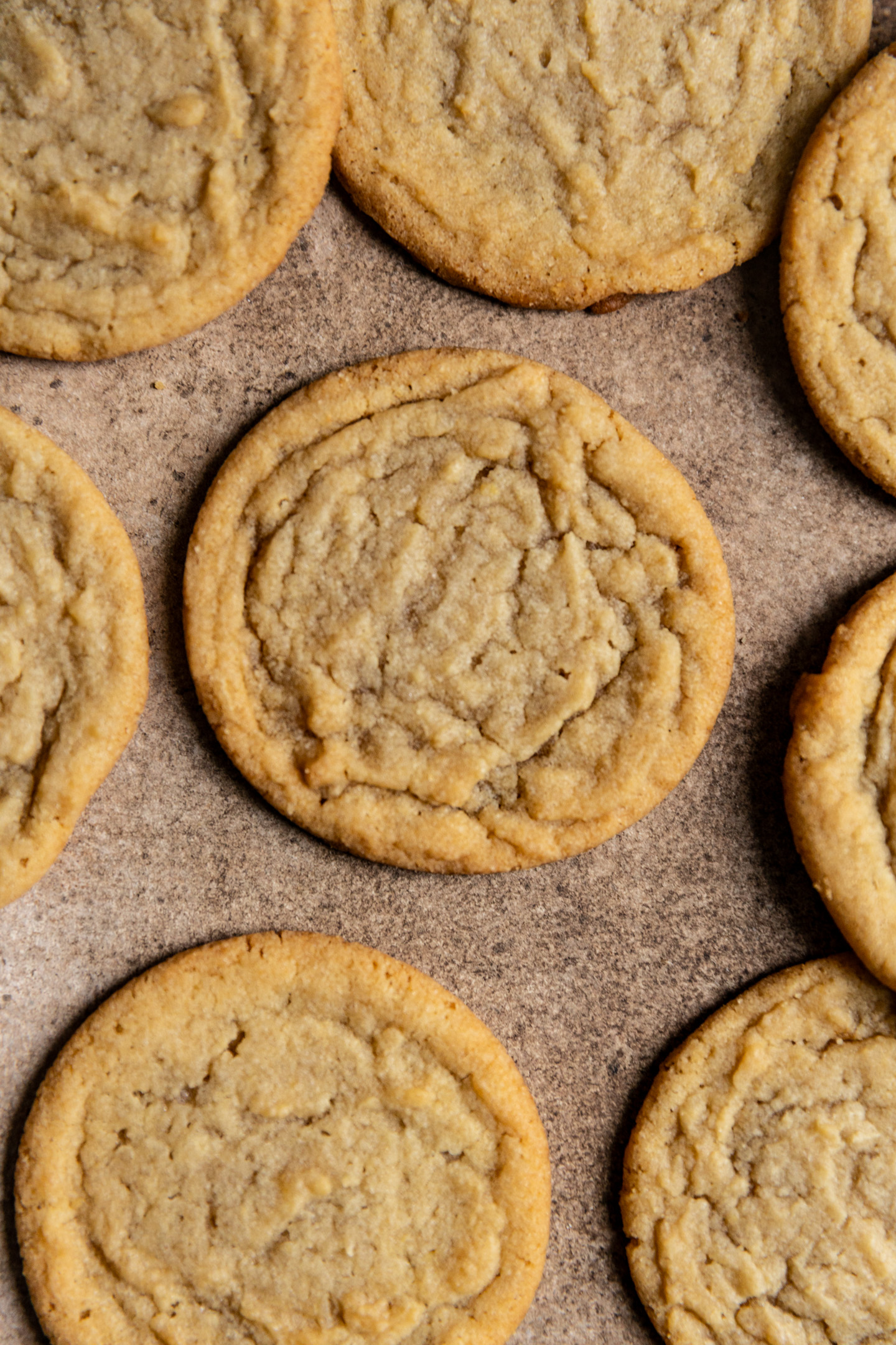 Brown sugar cookies on a brown surface.