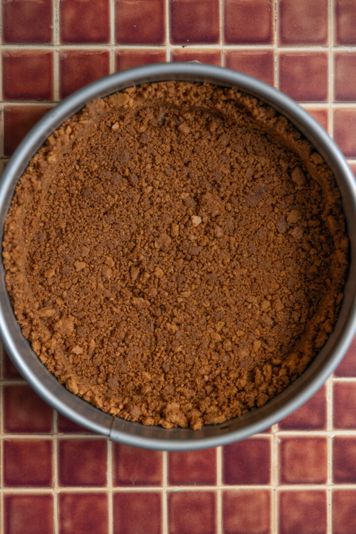 A cookie crust pressed into a springform pan.