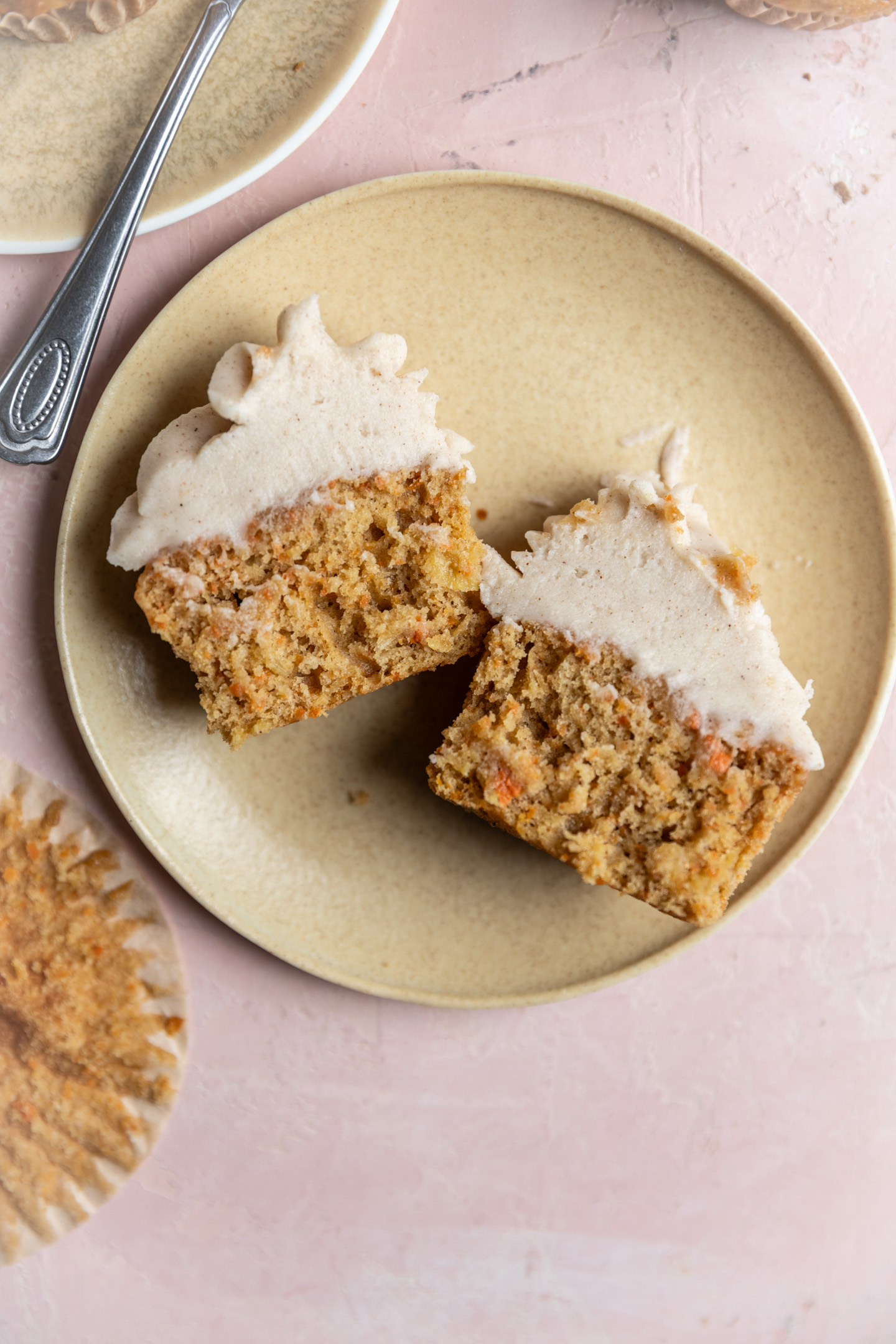 A carrot cake cupcake with pineapple split in the middle