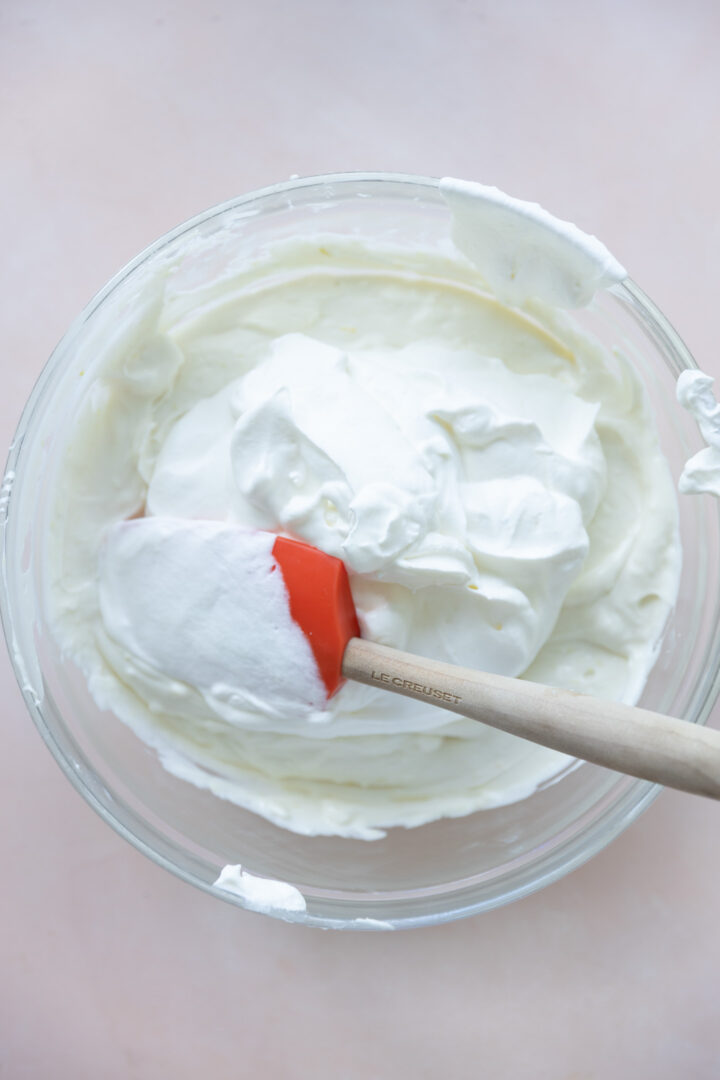 Whipped cream folded into a cream cheese mixture.