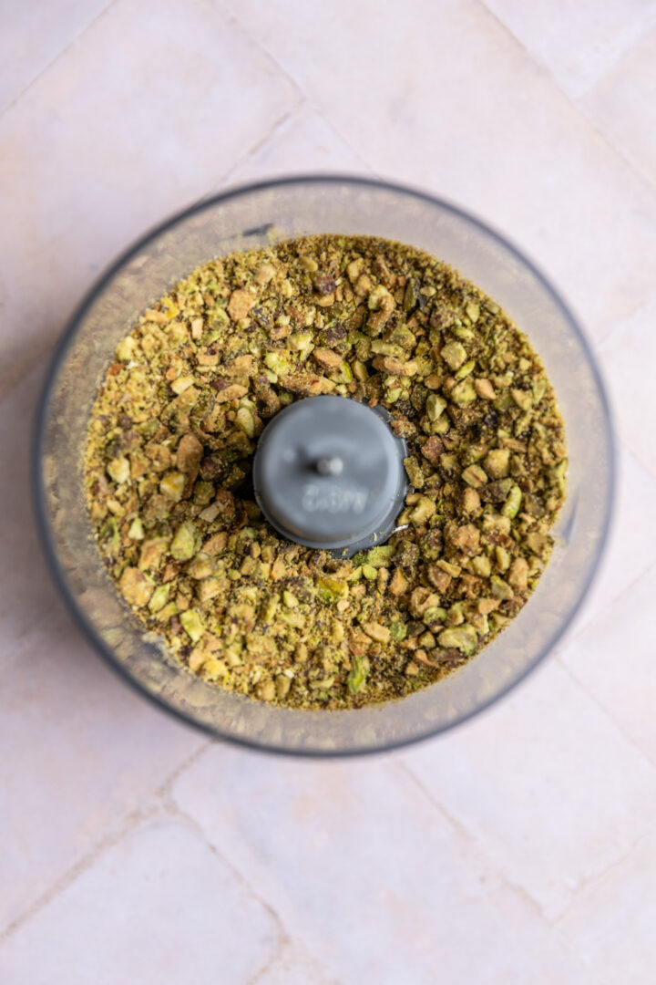 Pistachios chopped in a food processor.