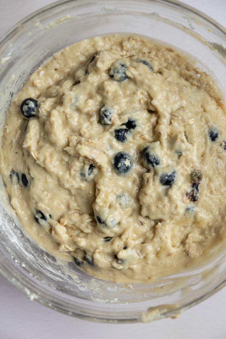 Batter for banana blueberry oat muffins in a bowl.