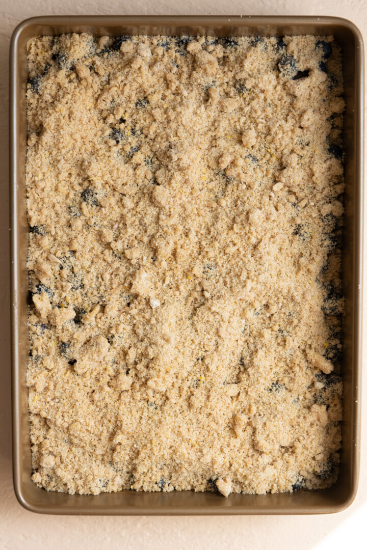 A crumb topping layered in a 9x13 pan.
