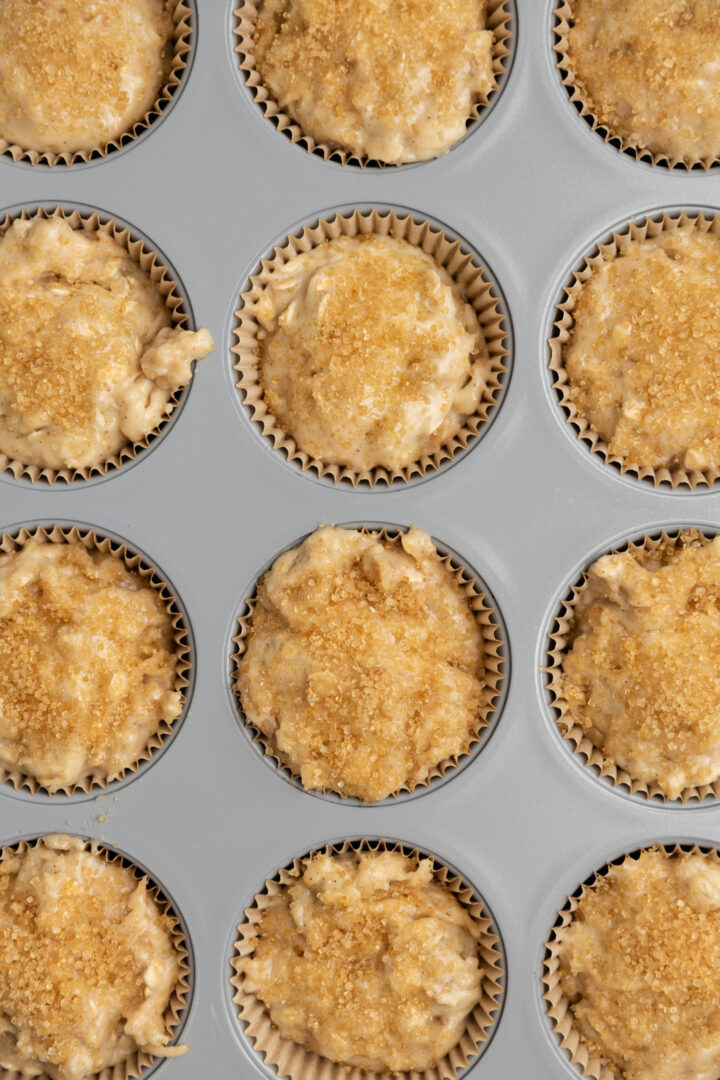 Muffin batter in a muffin tin.